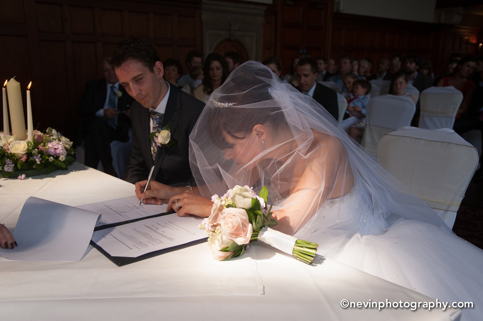 Signing the Register in Thomas Prior Hall Wedding