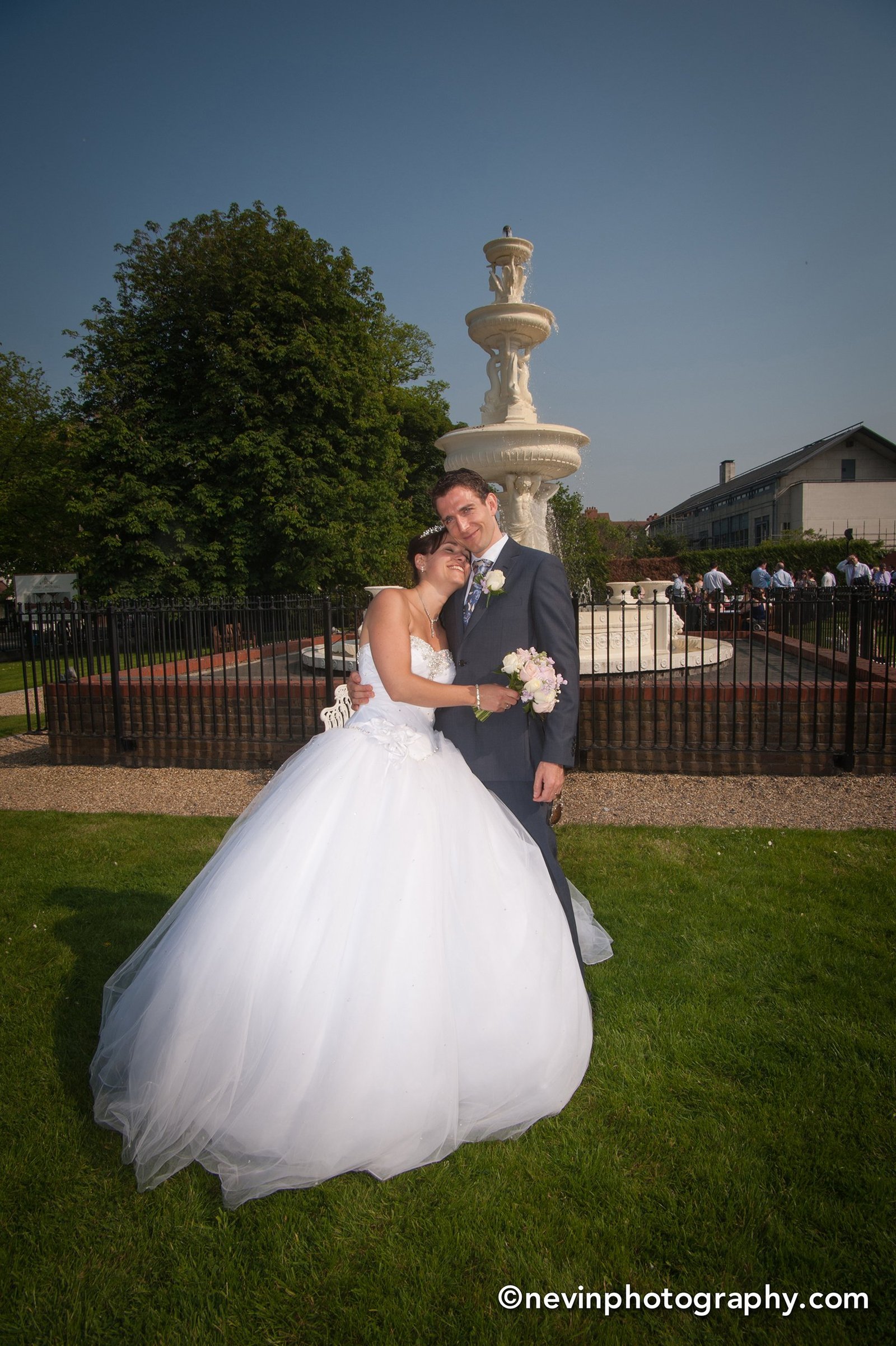 Bride hugging her husband at wedding reception in Prior Hall Dublin 4